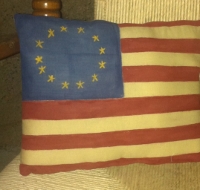 PRIMITIVE FLAG PILLOW